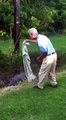 Stupid golfer tries to fight an alligator to get his golf ball back