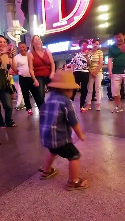 baby dancing for tips at Freemont Experience