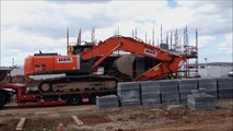 Hitachi EX350 excavator coming off lowbed