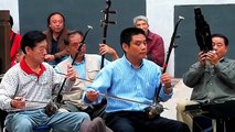 Traditional Chinese music ensemble in Beihai Park, central Beijing, China