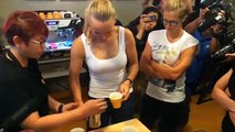 Tennis star Caroline Wozniacki, tries her hand at coffee brewing and latte art at social enterprise