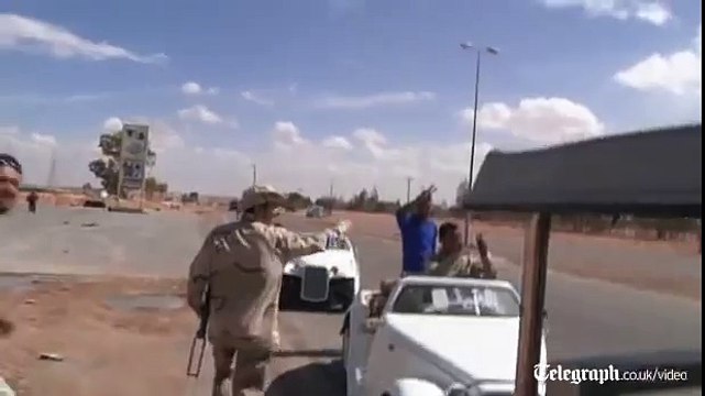 Libyan fighters loot Muammar Gaddafi's luxury cars