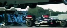 world record stunt,giant truck jump over speeding lotus racing car