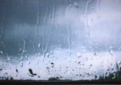 Rain Drops on a Window in Slow Motion