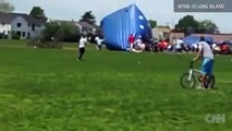 13 injured when INFLATABLE-BOUNCE HOUSE blows away