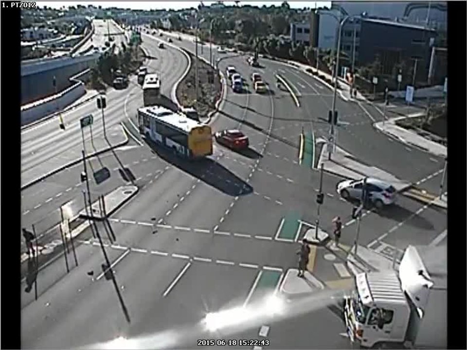 Motorcycle narrowly misses pedestrians following crash