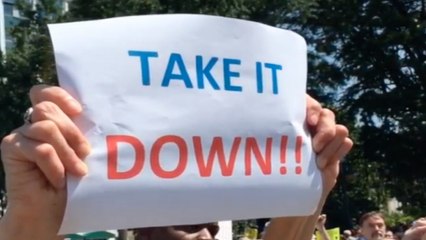 Demonstrators rally against Confederate flag