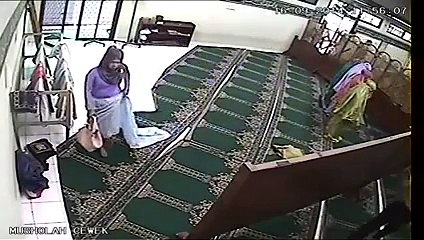 Women In Mosque What is She Doing