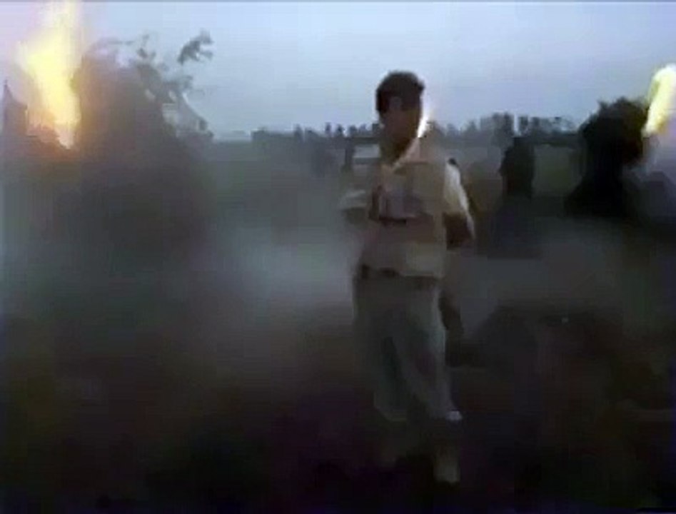 Field reporter reporting about the burning of some seized Marijuana plants. His takes after getting stoned are all hilarious