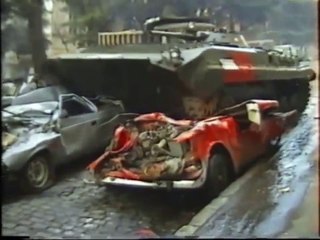 Unique war. Before fight, car press by BMP and spectacle's unarmed viewers. Tbilisi, Georgia 12.1991