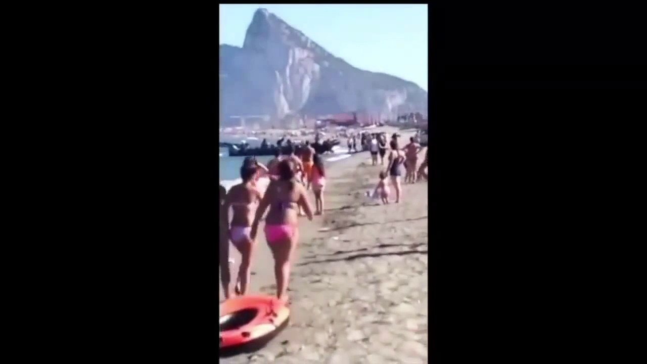 Drug dealers unloading drug on spanish beach in front of people