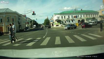 Biker Lands on Car Roof After Crash