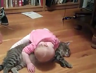 Baby playing with Tolerant cat
