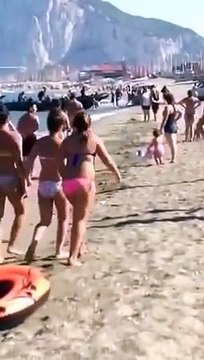 Drug dealers transporting product in front of tourists on the beach!