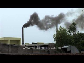 The smokestacks of chemical plants send pollution into Faridabad's air