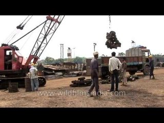 Indian labourers working at a ship breaking site in Alang