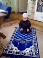 cute little boy praying Muslims prayer