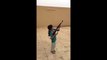 Young muslim girl firing AK-47 rifle... Close to dramatic fail!