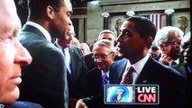 Jesse Jackson Jr. kisses President Barack Obama on the cheek.