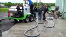 SERVPRO training on HCS hot water pressure washer trailer with waste water recycling & accessories.