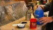 Spraying latex paint with a HVLP paint gun.
