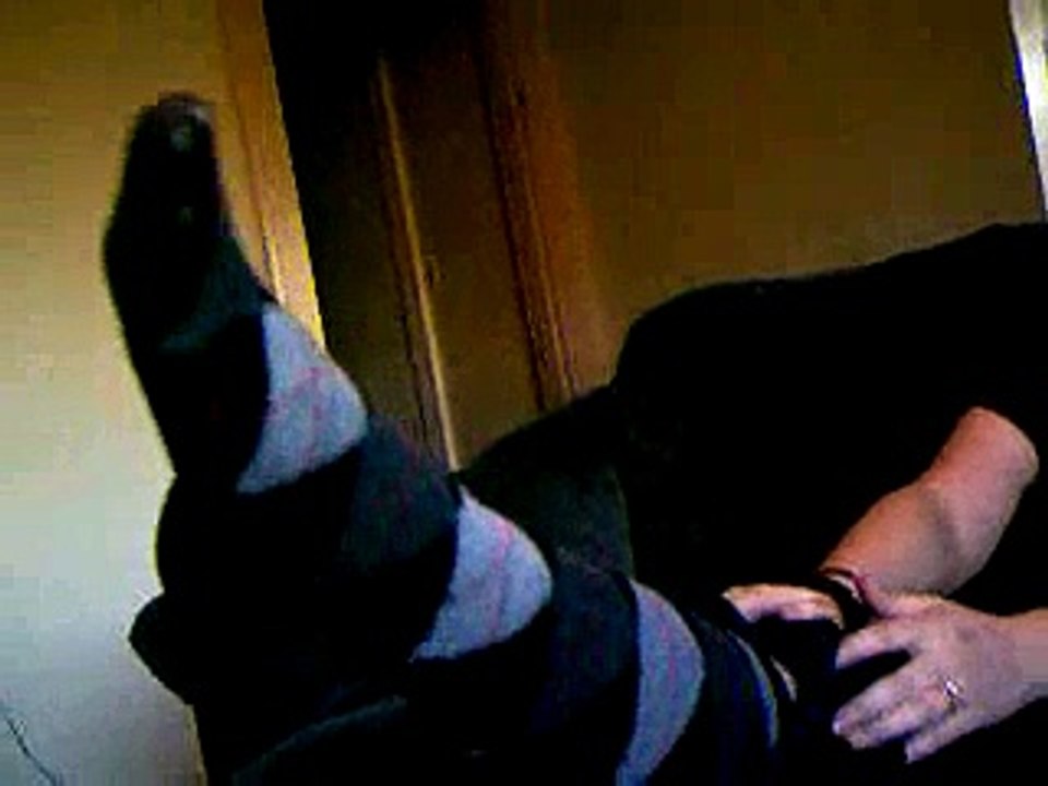 Wife smelling her own socks