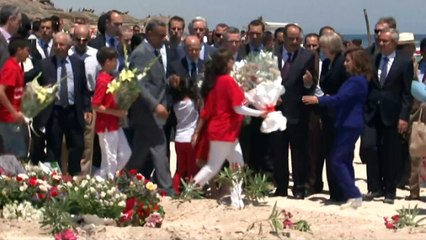 Theresa May lays flowers at scene of Tunisia attack