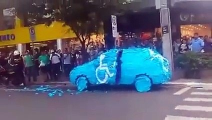 Non-handicapped dude parks at a handicapped spot. His car gets covered in stickers