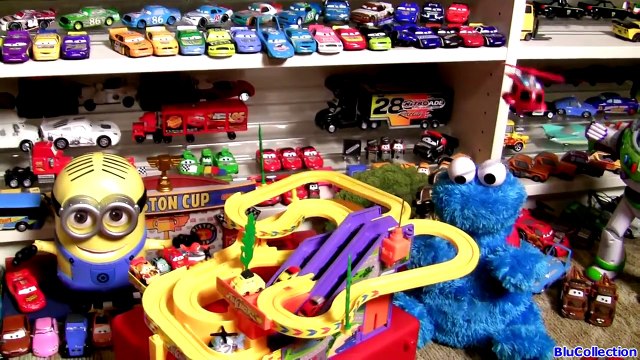 Cookie Monster at the Race Track Watching Mini Micro Cars Racing Up the Escalator by Blutoys