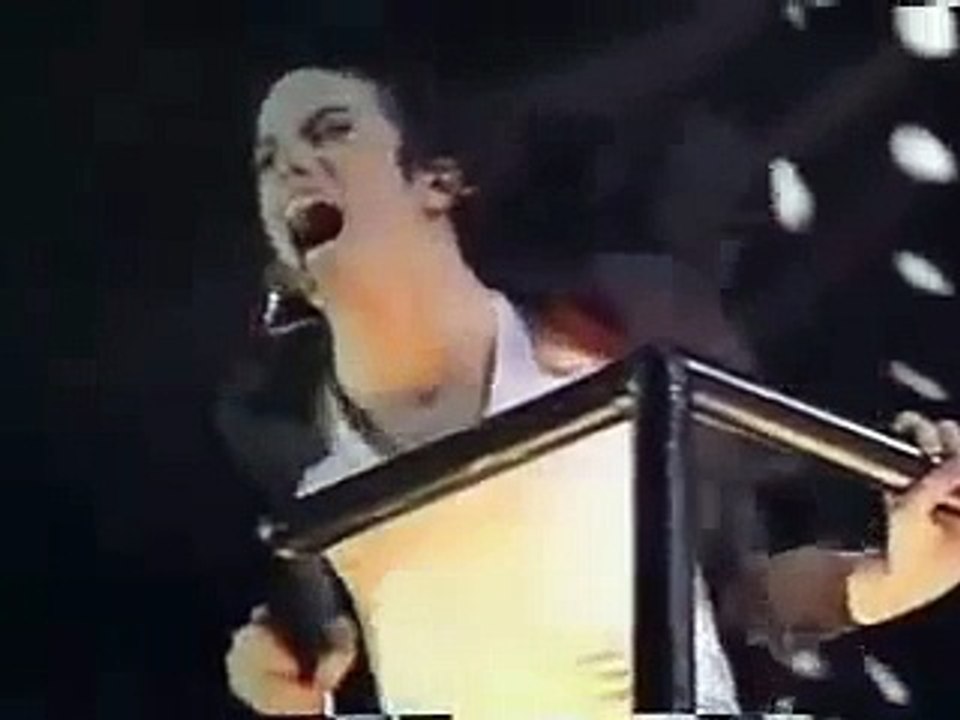 Korean fan jumps onto crane with Michael Jackson during Earth Song