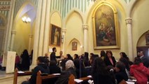 Palestinian Catholic parishioners singing a hymn during Mass at Annunciation parish in Beit Jala
