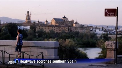 Spanish frolic in fountains to cool down