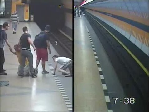 Youths risk lives to rescue man pushed onto subway track
