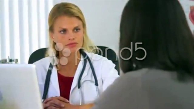 Asian woman expressing health concerns to her doctor. Stock Footage