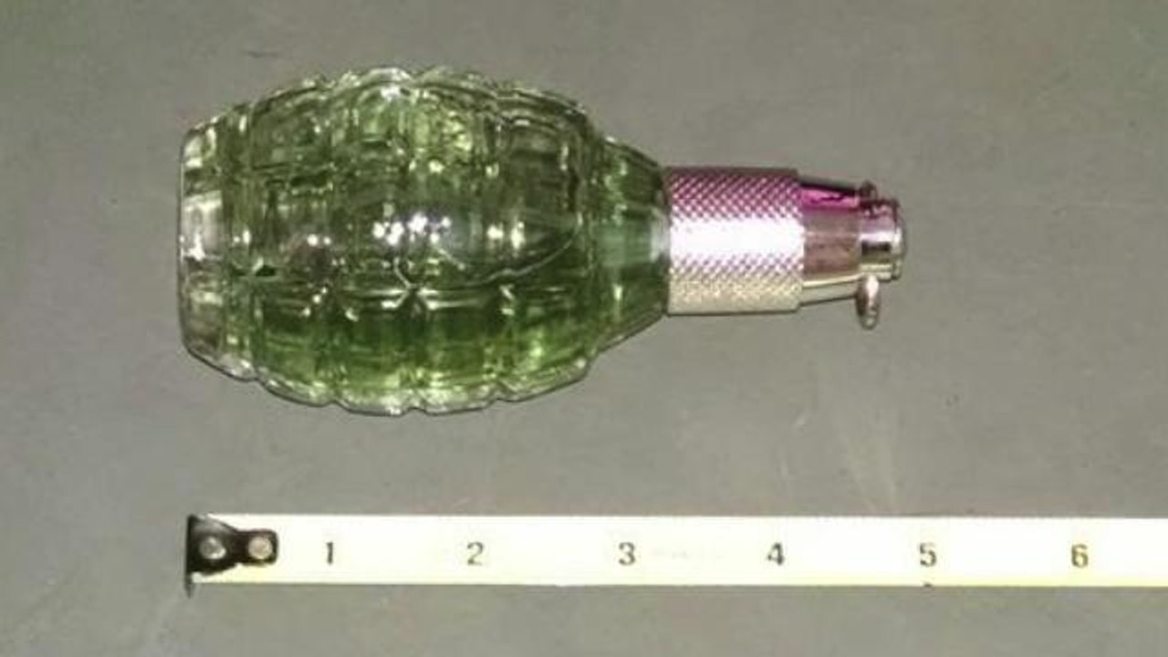 Grenade-shaped perfume bottle shuts down courth...