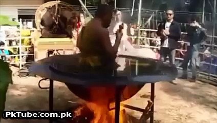 Man sitting and Worshiping in the Hot Oil