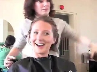 A woman cuts off her ponytail, then gets a buzzcut