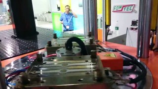 FOMTEC LSR TWO COLOR WATCH BAND IN AUTOMATION by FOMTEC Vertical Injection Molding Machine