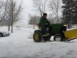 The 1977 JD 210 plowing snow