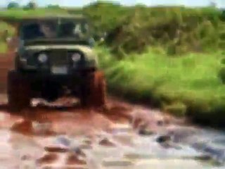 Jeep CJ5 mudding in small puddles,  1972 JEEP