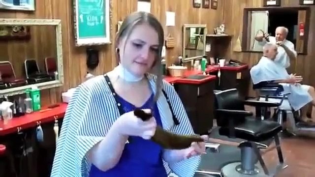 hair getting all chopped off at a barbershop