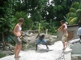 All Hands Volunteers sledging on the rubble site in Leogane, Haiti