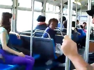 old guy beats a young black man on a bus