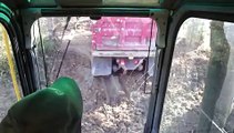 Excavator loading mud into Dump Truck