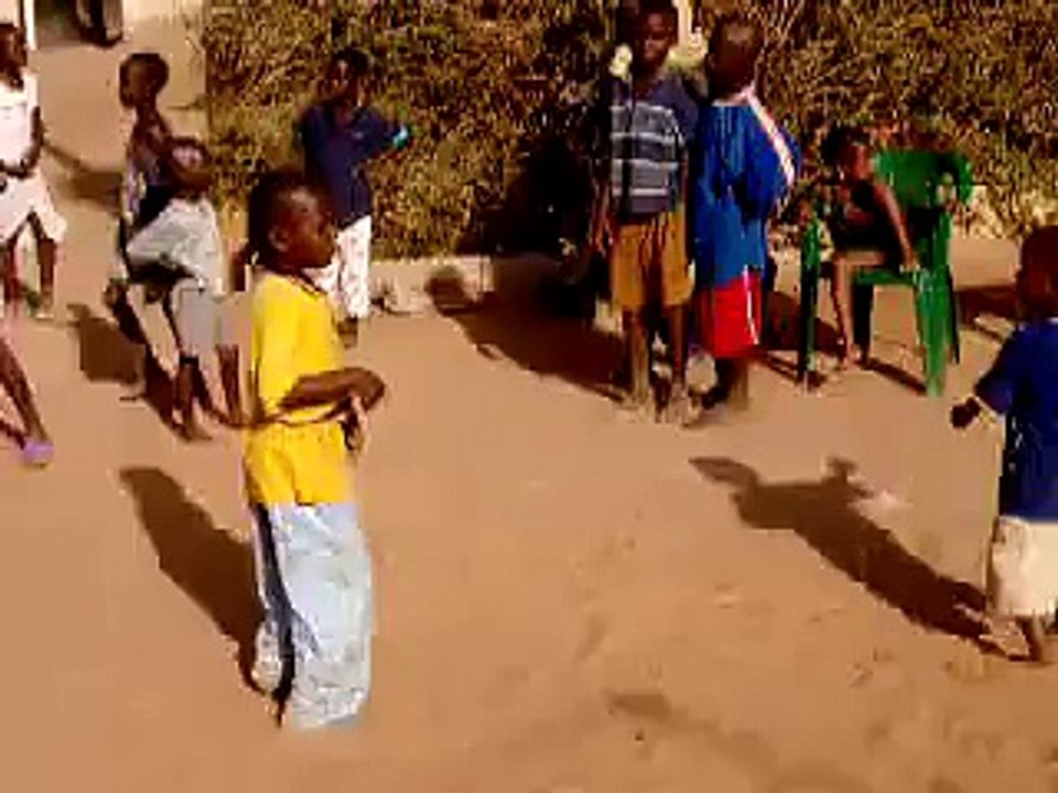 The little boys dancing to the drumming rythms