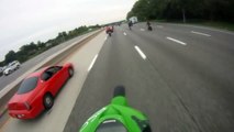 Motorcycle rider Crashes a Wheelie on the highway and hits car