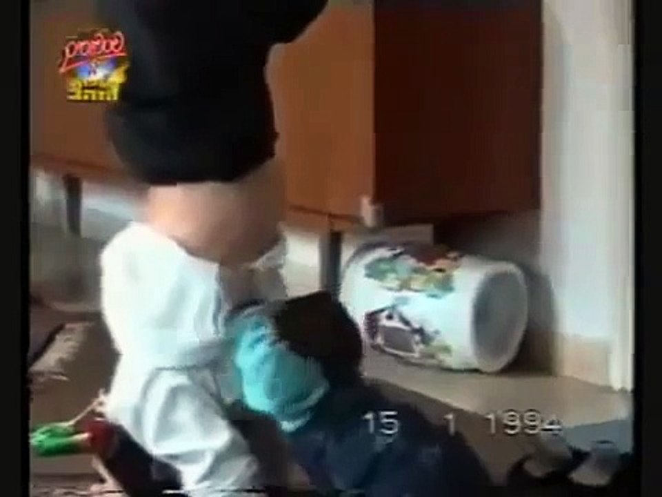 BABY SHOW. baby breast feeding from mom standin...