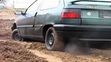 She gets stuck! Wheels are spinning when she is revving the engine