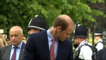 Prince George peers into baby sister's pram at christening