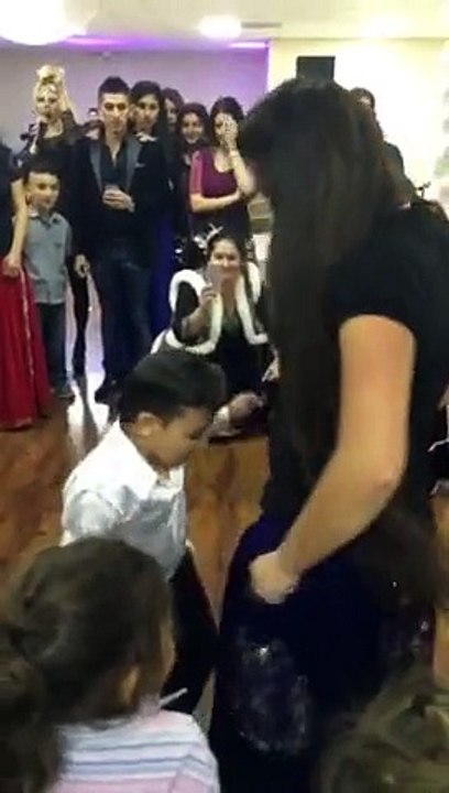 Little Boy and Young Beautiful Girl Dance in Party